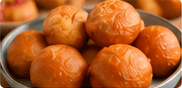 A bowl of golden puff puff